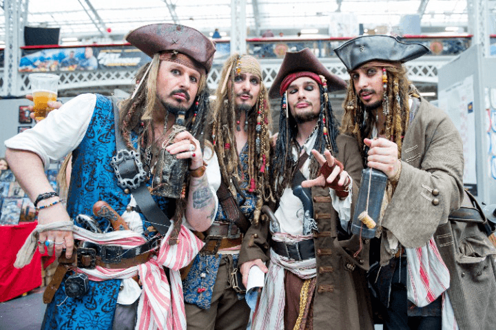 Four people dressed as pirates, reminiscent of a costume event. Keywords: Pawna lake, stay.
